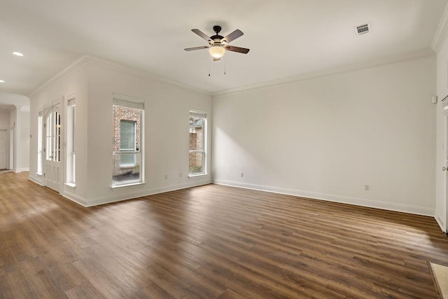 spare room featuring baseboards, visible vents, dark wood-style flooring, and ceiling fan