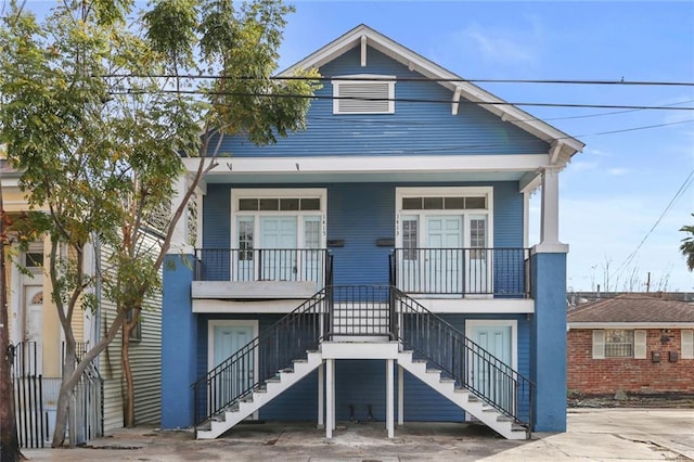 view of front of house featuring stairway