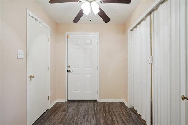 entryway featuring ceiling fan, baseboards, and dark wood finished floors