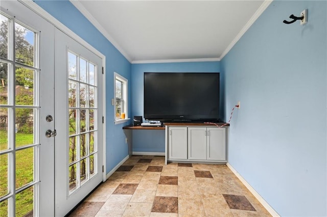 entryway featuring ornamental molding, a healthy amount of sunlight, and baseboards