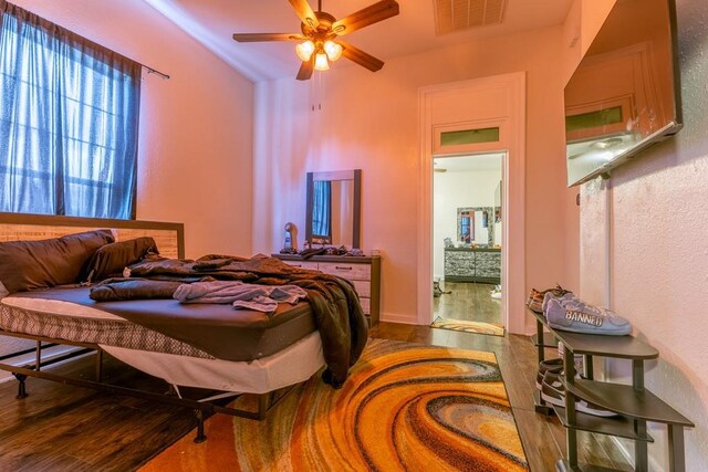 226062 N Roman St, New Orleans, LA 70117 - bedroom with ceiling fan, wood finished floors, and visible vents