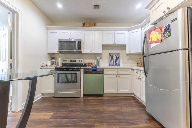 226062 N Roman St, New Orleans, LA 70117 - kitchen with light countertops, dark wood-style flooring, appliances with stainless steel finishes, and white cabinetry