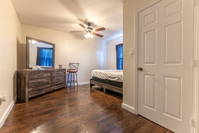 226062 N Roman St, New Orleans, LA 70117 - bedroom with dark wood finished floors, baseboards, and ceiling fan