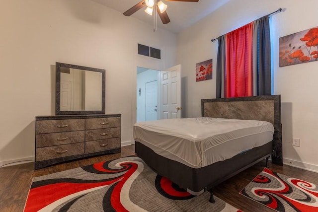 226062 N Roman St, New Orleans, LA 70117 - bedroom with visible vents, baseboards, a towering ceiling, wood finished floors, and ceiling fan