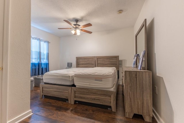 226062 N Roman St, New Orleans, LA 70117 - bedroom with a ceiling fan, baseboards, a textured ceiling, and wood-type flooring