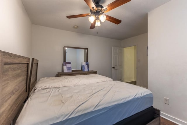 226062 N Roman St, New Orleans, LA 70117 - bedroom with ceiling fan, baseboards, and dark wood-style flooring
