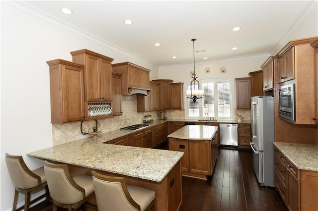 kitchen featuring brown cabinetry and stainless steel appliances