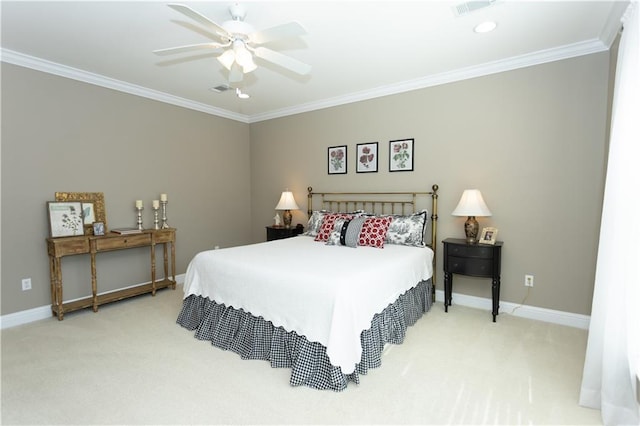 carpeted bedroom featuring baseboards, a ceiling fan, and crown molding