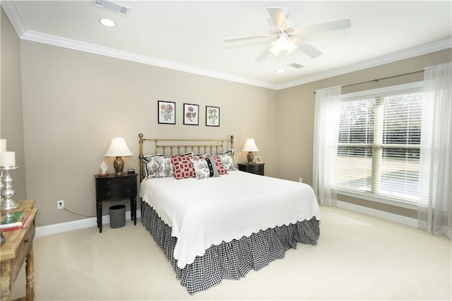 bedroom with light colored carpet, visible vents, ornamental molding, ceiling fan, and baseboards