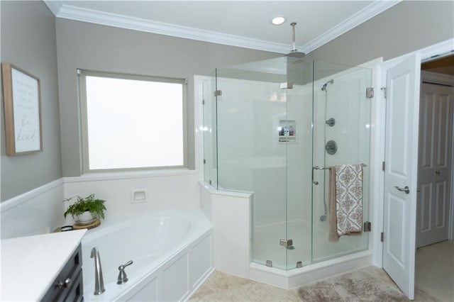 bathroom featuring ornamental molding, a stall shower, a garden tub, and vanity