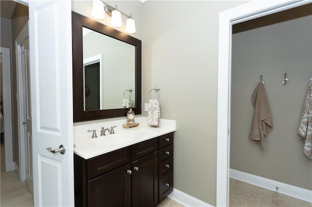 bathroom with vanity and baseboards