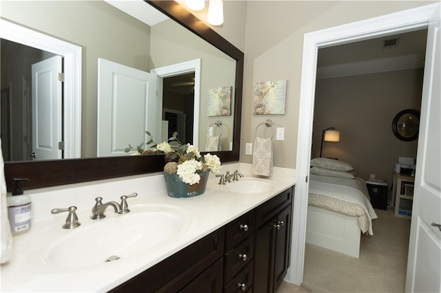 full bathroom with double vanity, visible vents, a sink, and ensuite bathroom