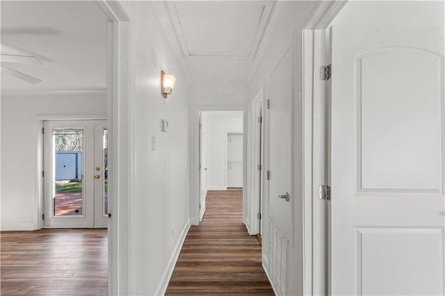 hall with baseboards, dark wood-style flooring, and crown molding