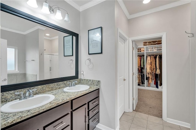 full bath featuring a spacious closet, a sink, and crown molding