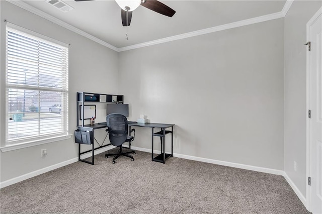 office with baseboards, visible vents, carpet flooring, and ornamental molding