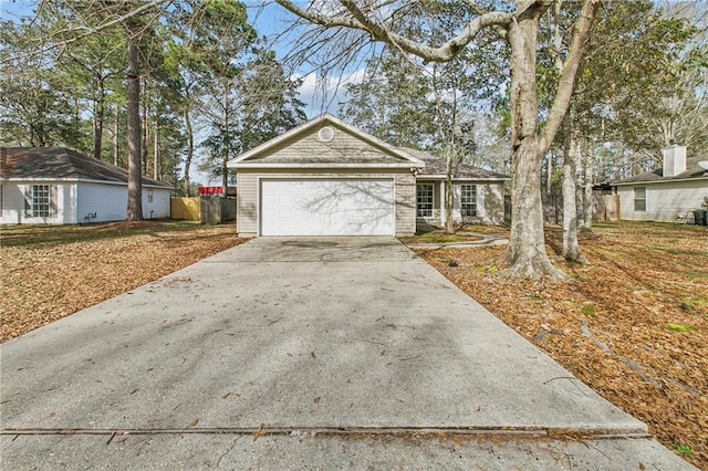 single story home with an attached garage and concrete driveway