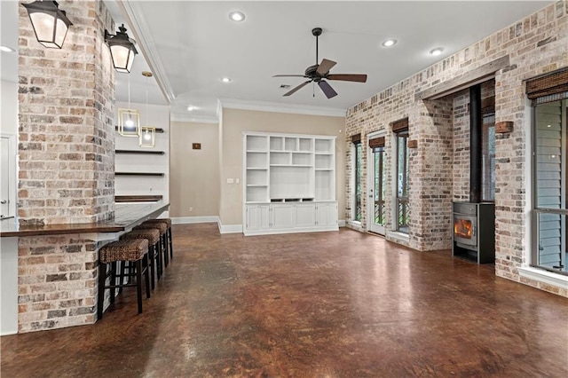 unfurnished living room with brick wall, baseboards, concrete flooring, and recessed lighting