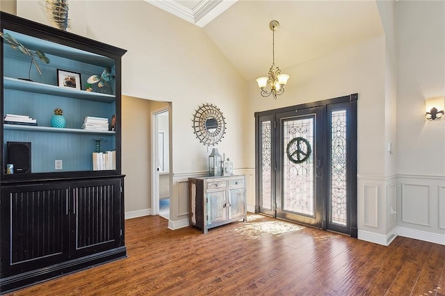 1042 Mariners Cove Blvd, Slidell, LA 70458 - entrance foyer with a chandelier, wood finished floors, crown molding, and high vaulted ceiling