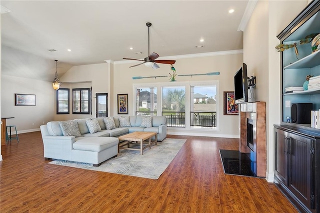 1042 Mariners Cove Blvd, Slidell, LA 70458 - living room with a ceiling fan, wood finished floors, a fireplace, ornamental molding, and recessed lighting