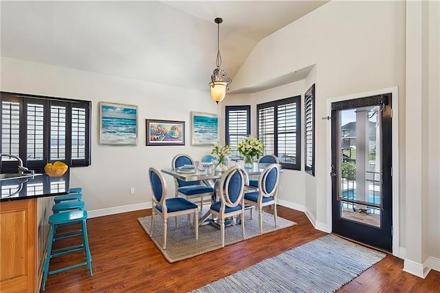 1042 Mariners Cove Blvd, Slidell, LA 70458 - dining space with dark wood finished floors and lofted ceiling