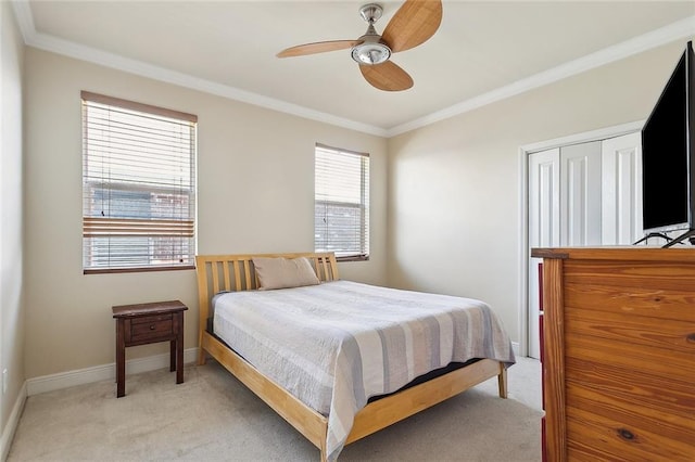 1042 Mariners Cove Blvd, Slidell, LA 70458 - bedroom with light colored carpet, crown molding, a ceiling fan, and a closet