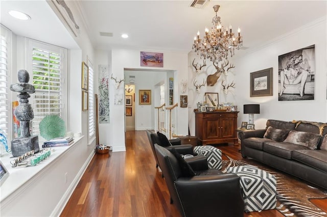 living area featuring baseboards, dark wood-type flooring, visible vents, and crown molding