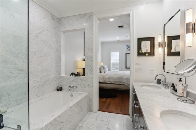 full bath with visible vents, ornamental molding, a bath, double vanity, and ensuite bath