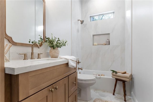 full bathroom featuring toilet, marble finish floor, shower / bathing tub combination, and vanity