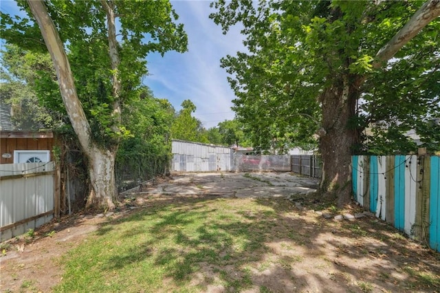 view of yard with a fenced backyard