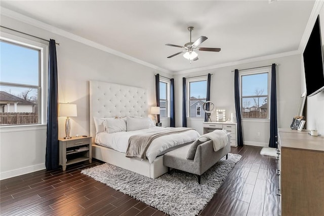 bedroom with baseboards, ceiling fan, crown molding, and wood tiled floor