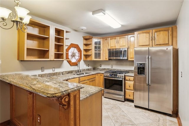 5116 Franklin Ave, New Orleans, LA 70122 - kitchen featuring appliances with stainless steel finishes, a sink, open shelves, a peninsula, and stone counters