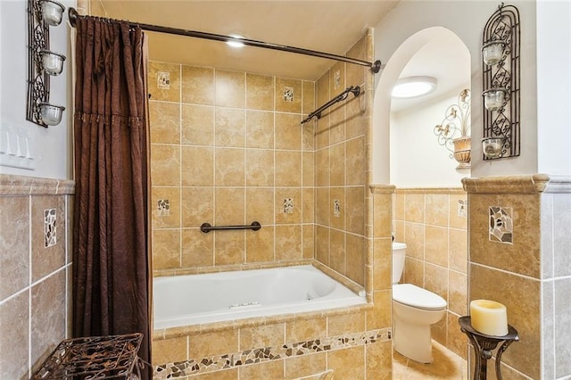 5116 Franklin Ave, New Orleans, LA 70122 - full bath with tile walls, tiled shower / bath, toilet, and wainscoting