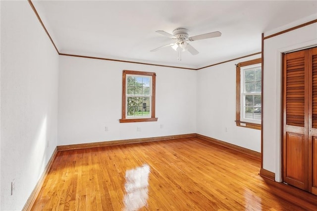 5116 Franklin Ave, New Orleans, LA 70122 - unfurnished bedroom with crown molding, light wood finished floors, baseboards, and ceiling fan