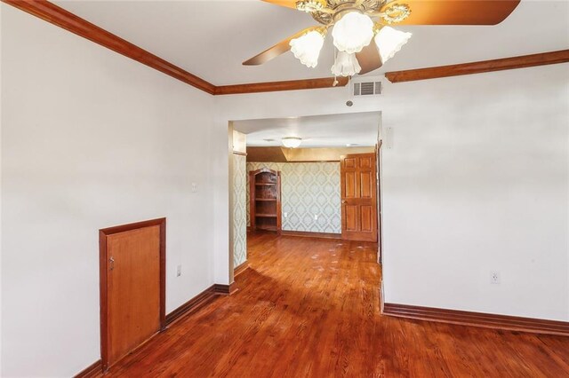 5116 Franklin Ave, New Orleans, LA 70122 - unfurnished room featuring baseboards, ceiling fan, wood finished floors, and crown molding