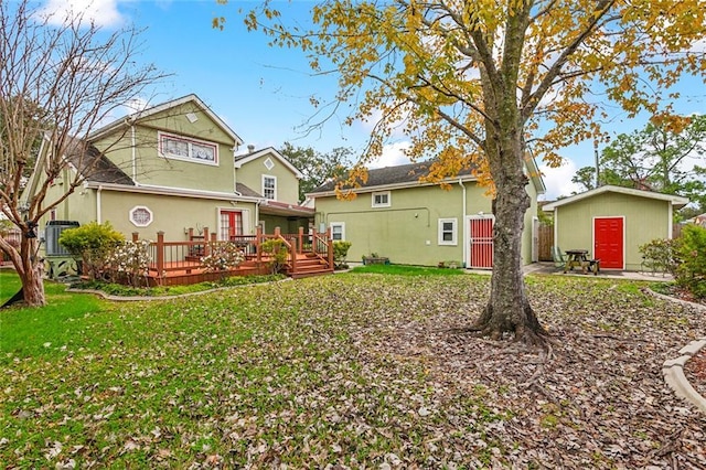 5116 Franklin Ave, New Orleans, LA 70122 - rear view of property featuring a wooden deck and a yard