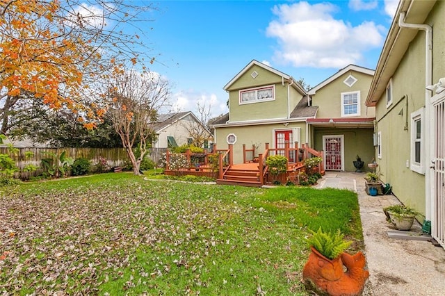 5116 Franklin Ave, New Orleans, LA 70122 - back of property featuring stucco siding and a deck