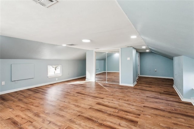 5116 Franklin Ave, New Orleans, LA 70122 - additional living space featuring lofted ceiling, wood finished floors, and baseboards