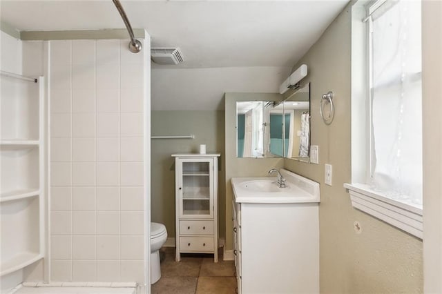 5116 Franklin Ave, New Orleans, LA 70122 - full bath with vanity, toilet, a shower, and tile patterned flooring