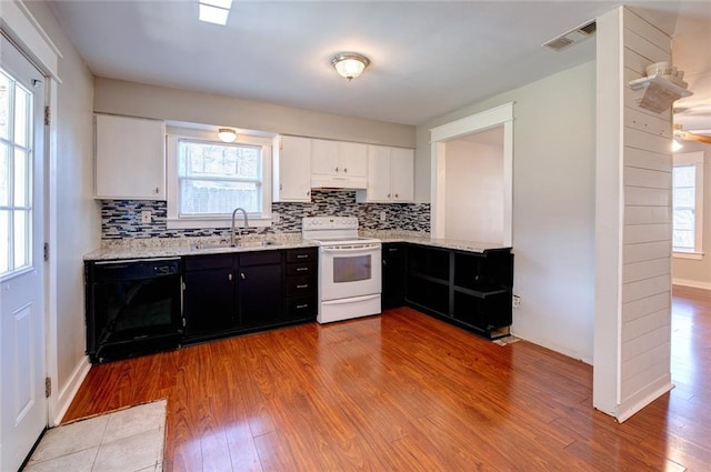 kitchen featuring black dishwasher, white electric stove, white cabinets, dark cabinets, and a sink