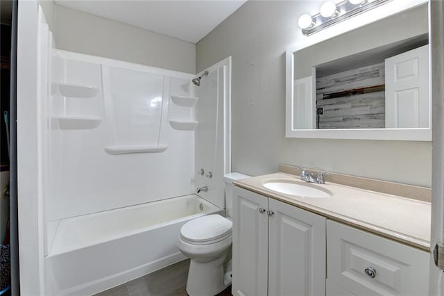 bathroom with toilet, washtub / shower combination, and vanity