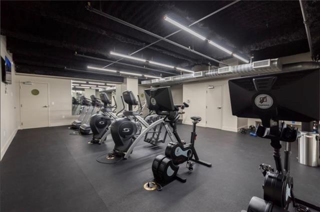 gym with visible vents and baseboards