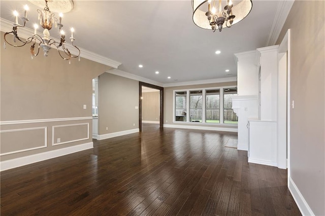 unfurnished living room featuring a chandelier, dark wood-style flooring, recessed lighting, and crown molding