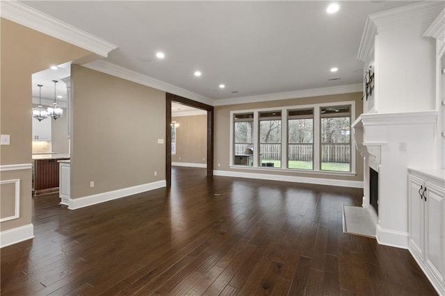 unfurnished living room with baseboards, a fireplace with flush hearth, ornamental molding, and dark wood-type flooring