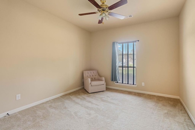 unfurnished room with light carpet, ceiling fan, and baseboards