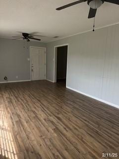 unfurnished living room featuring ceiling fan, dark wood-style floors, and baseboards