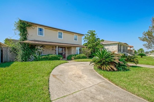 view of front of house featuring a front yard and fence