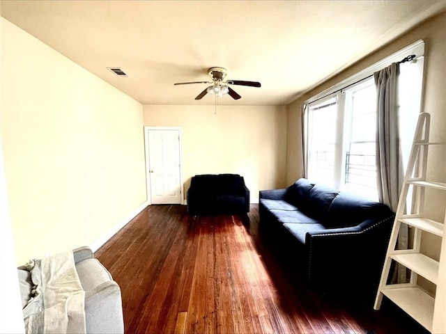 2425-27 Nashville Ave, New Orleans, LA 70115 - living area with dark wood-type flooring, visible vents, baseboards, and a ceiling fan