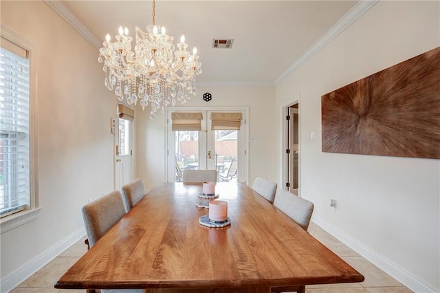 dining room with light tile patterned floors, baseboards, visible vents, crown molding, and a chandelier