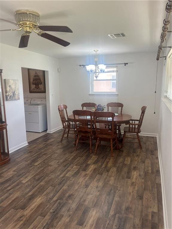 dining space featuring visible vents, dark wood-style flooring, and baseboards