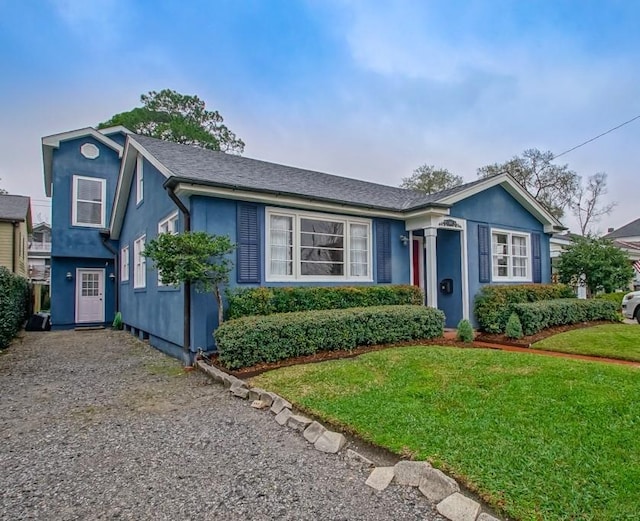 view of front of house featuring a front yard and stucco siding